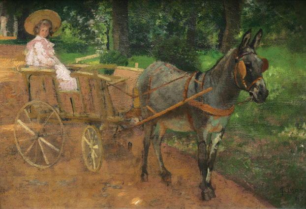 A donkey and a child in a pink dress on a barrow in a park
