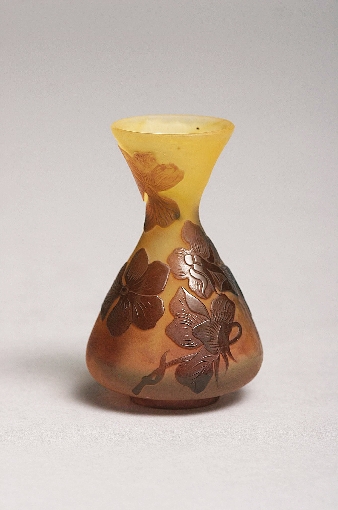 A small vase decorated with flowers
