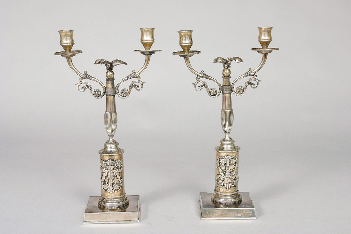 A pair of Berlin candle holders with ornament of eagles