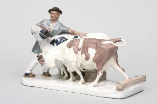 An art nouveau group 'farmer with cows'