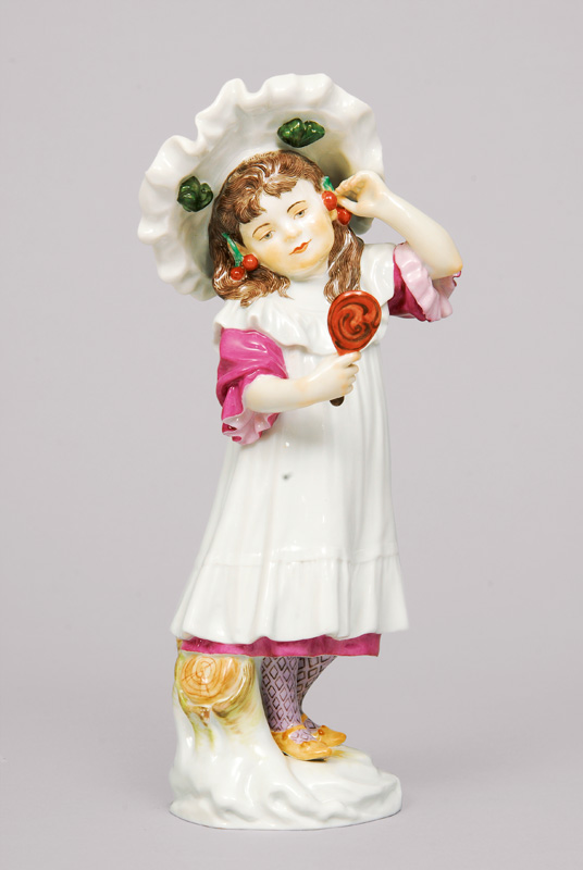 A figurine 'girl with mirror and cherry'