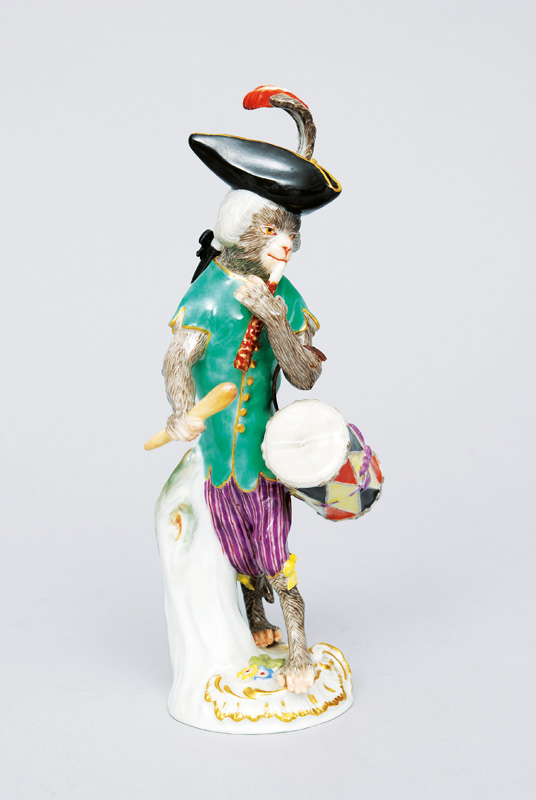 A figurine "drummer" of serial "music playing monkeys"