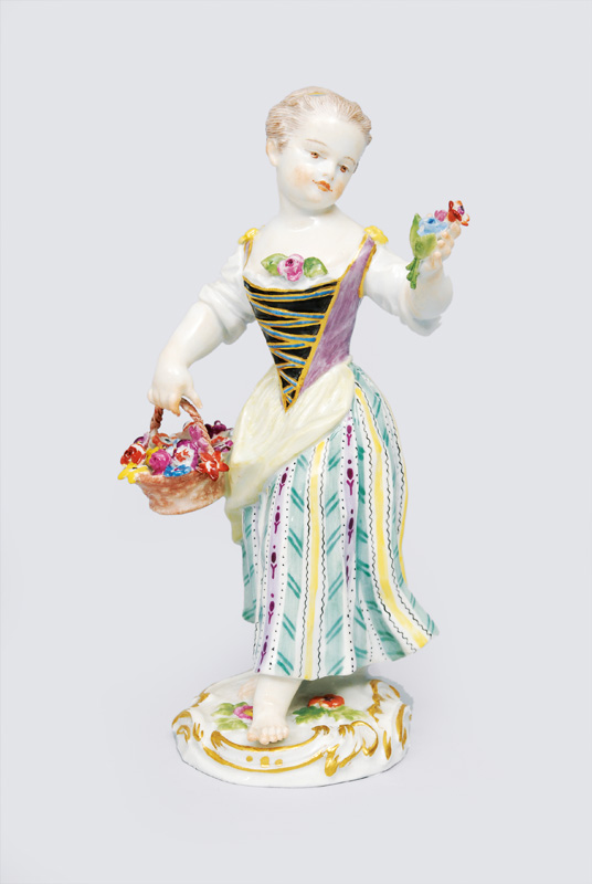 A figurine "Gardener"s child with flower basket"
