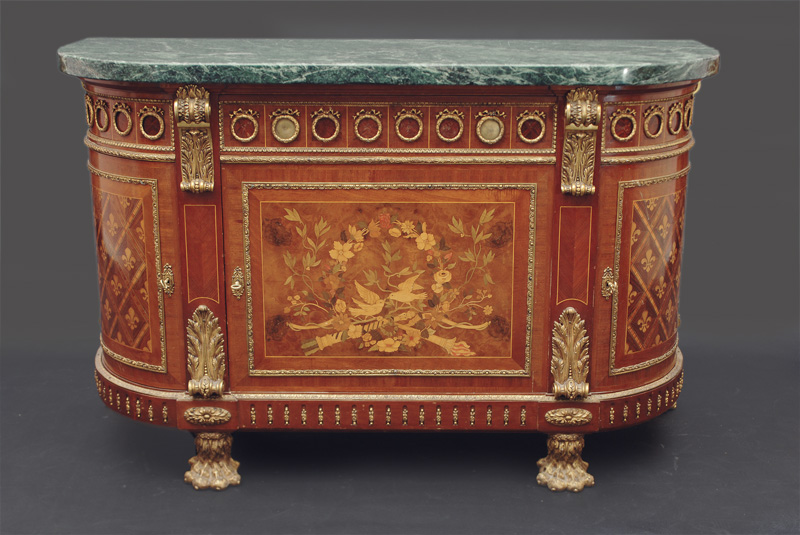 An extraordinary commode with bronze applications in Louis Seize style