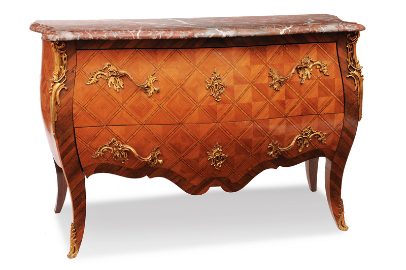 A great chest of drawers with lattice marqueterie in the style of Louis Quinze