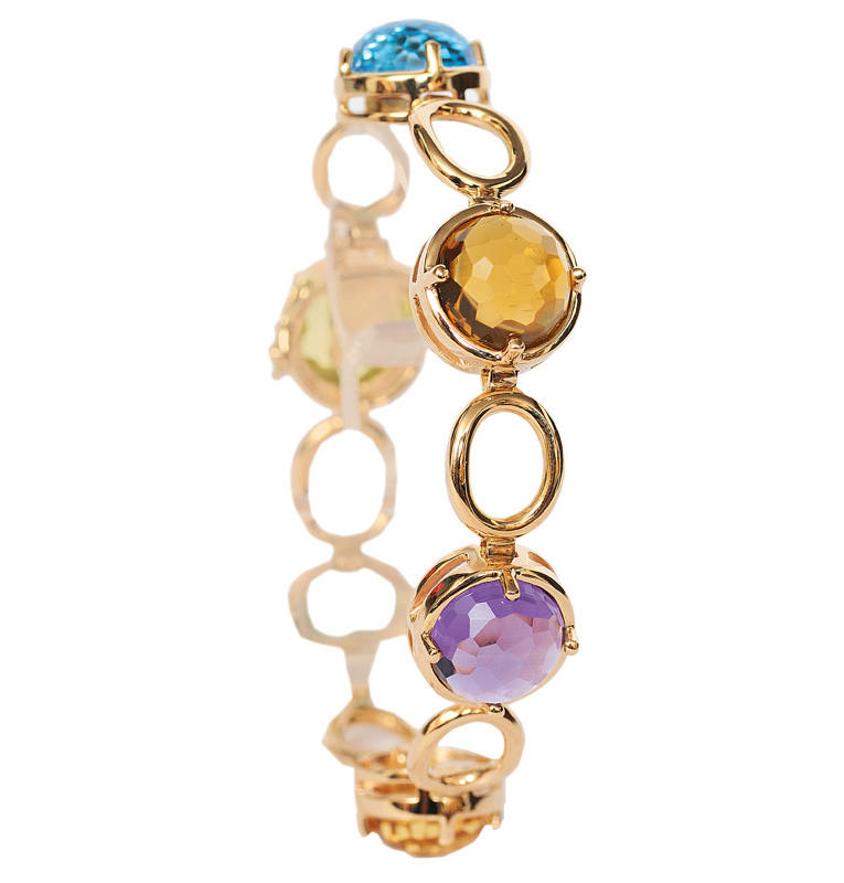 A golden bracelet with coloured stones