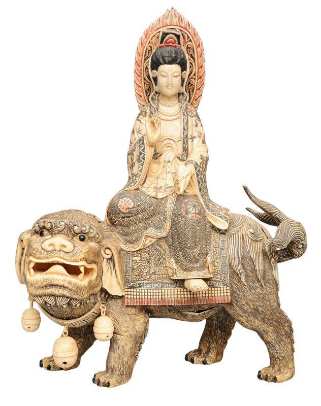 An unusual figurine 'Guanyin on a lion'