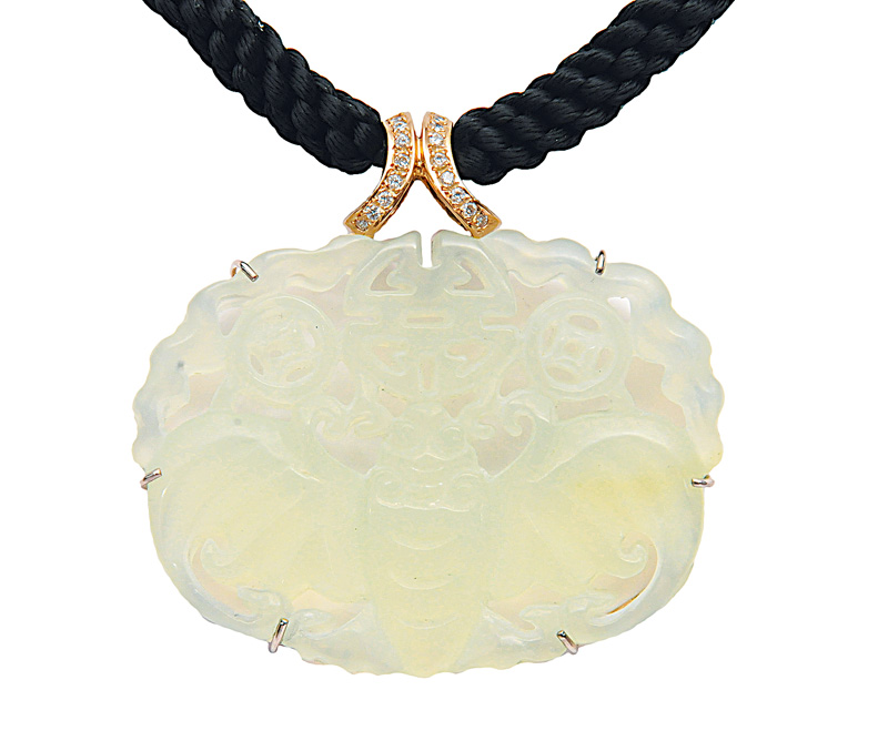 A jade diamond pendant with silk necklace
