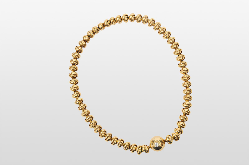 A golden necklace with diamond-clasp
