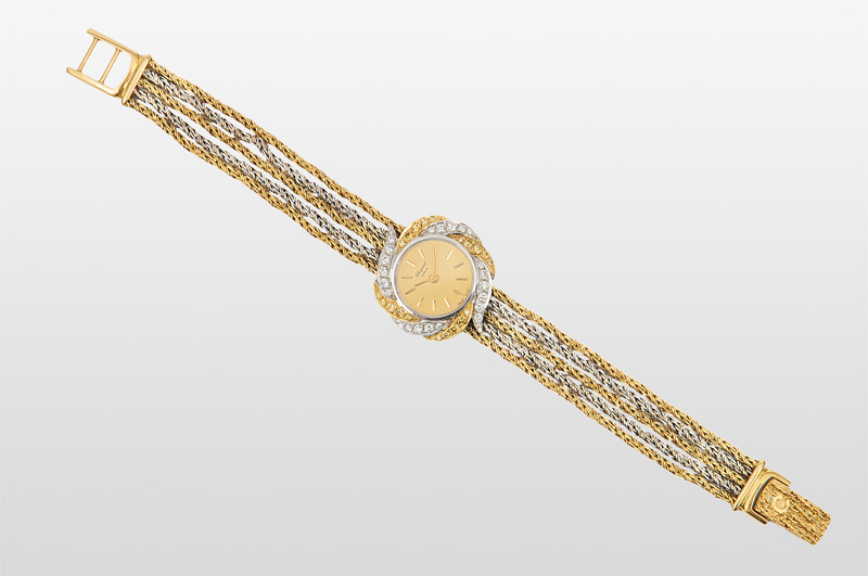 A ladies wrist watch with diamonds by Chopard