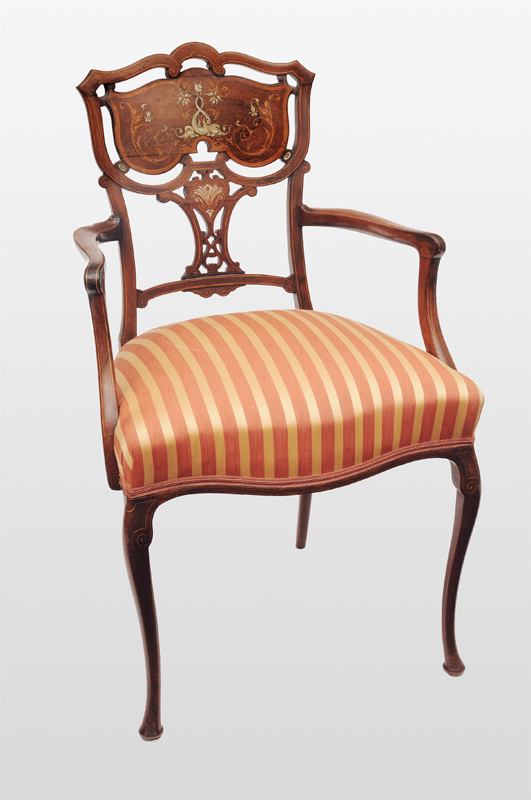 An armchaire with ivory and nacre marquetery