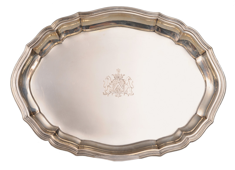 An oval tray with engraved coat of arms of the Family Roux