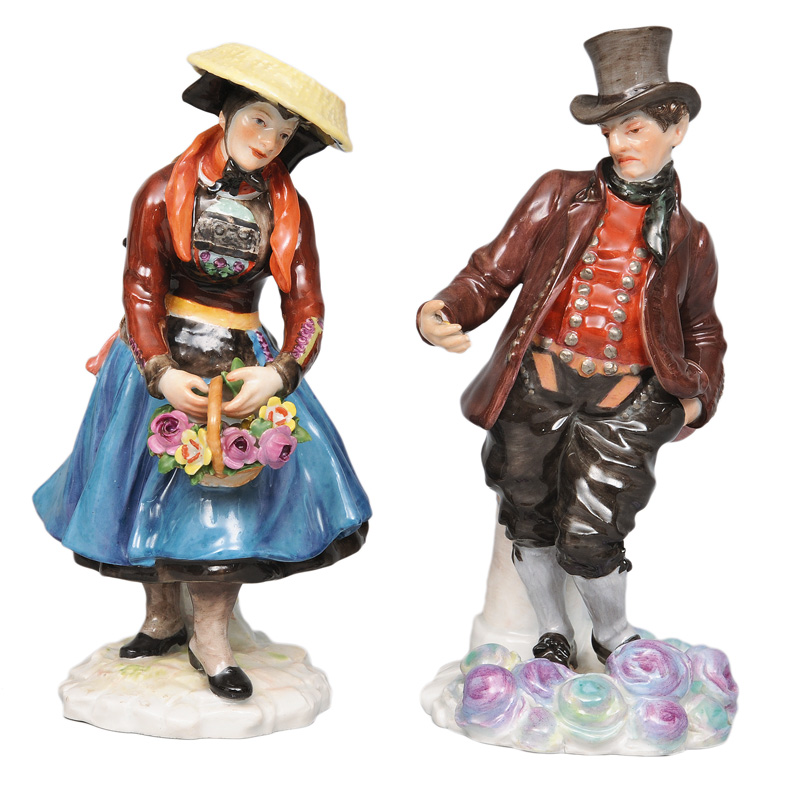 A pair of traditional costume figurines