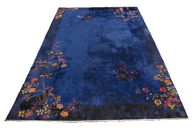 A large carpet with vases and peony flowers