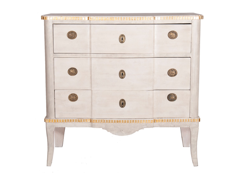 A coloured chest of drawer in the Gustavian style
