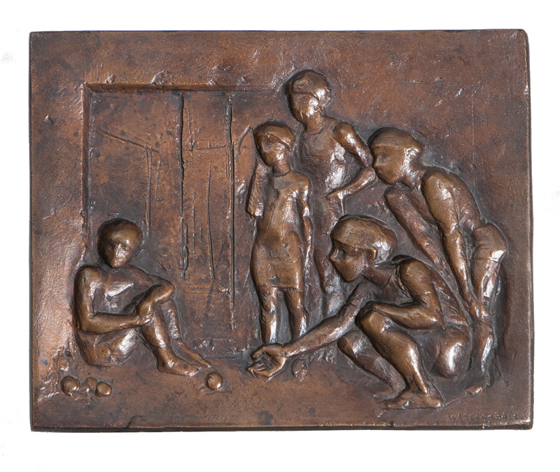 A bronze relief 'Children playing marble'
