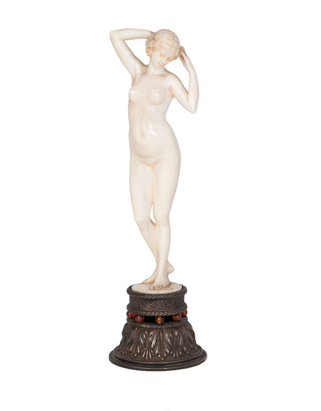 An Art Nouveau figure 'Posing nude'