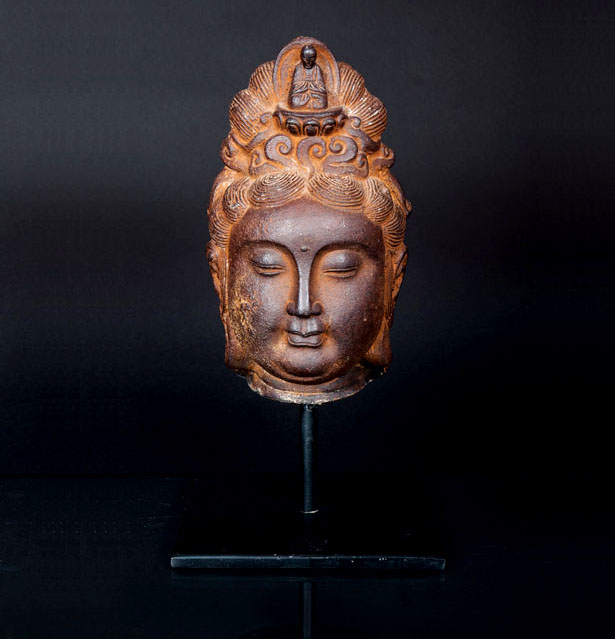 An iron head of  a bodhisattva