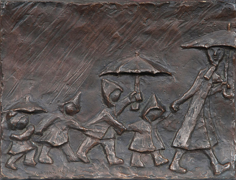 A bronze relief 'Walk in the rain'