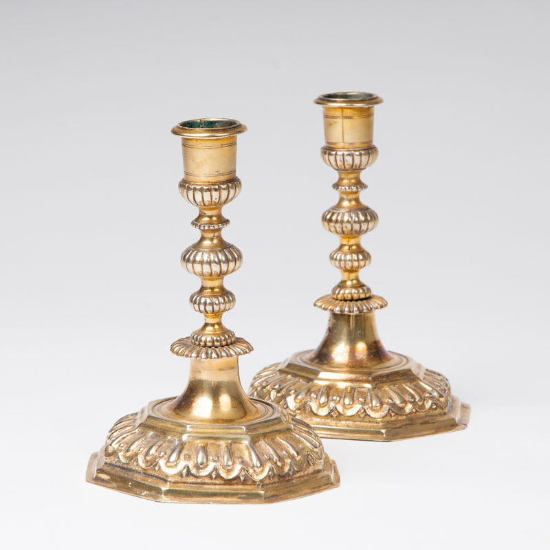 A rare pair of Régence candlesticks