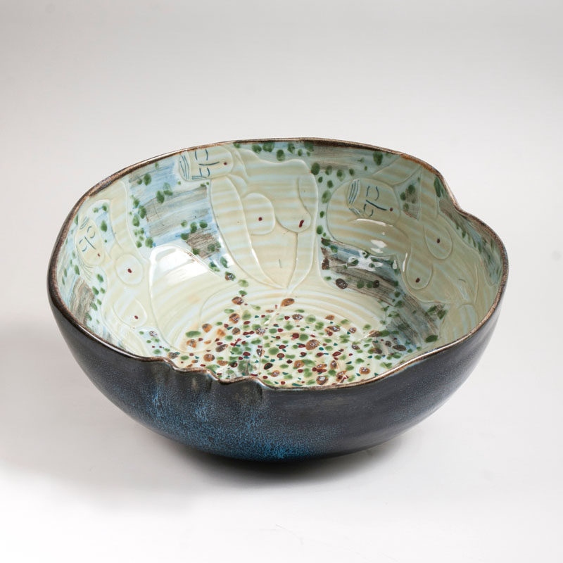 A large modern Chinese porcelain bowl with nude reliefs