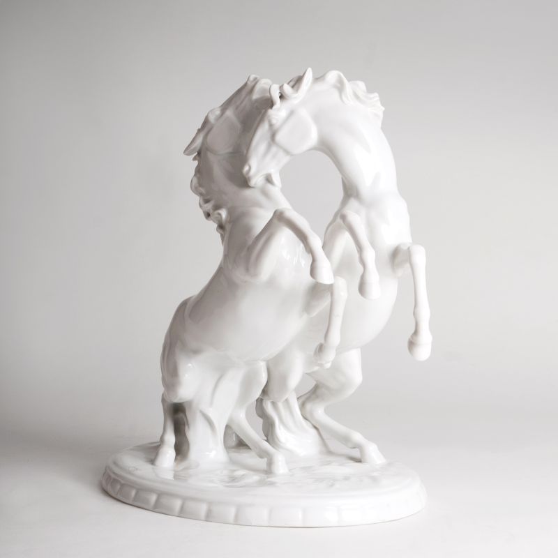 A porcelain group 'Pair of rearing stallions'