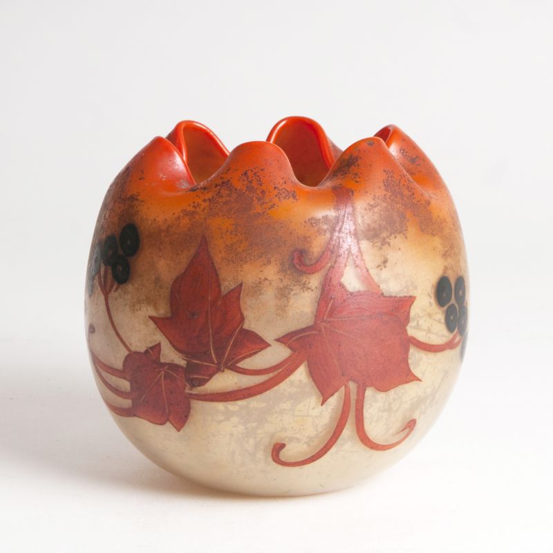 A spheric vase with vine decor