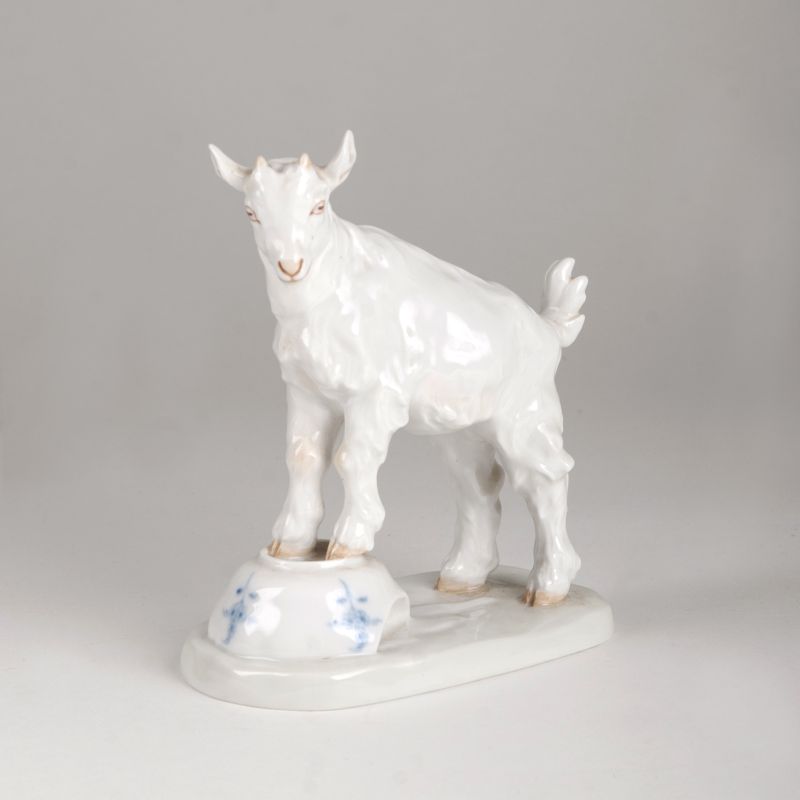 A porcelain figure 'Billy goat on a bowl'