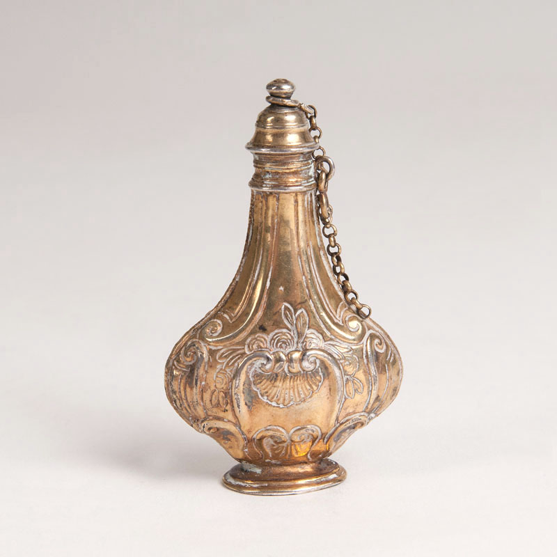 A baroque gilt-silver perfume flacon