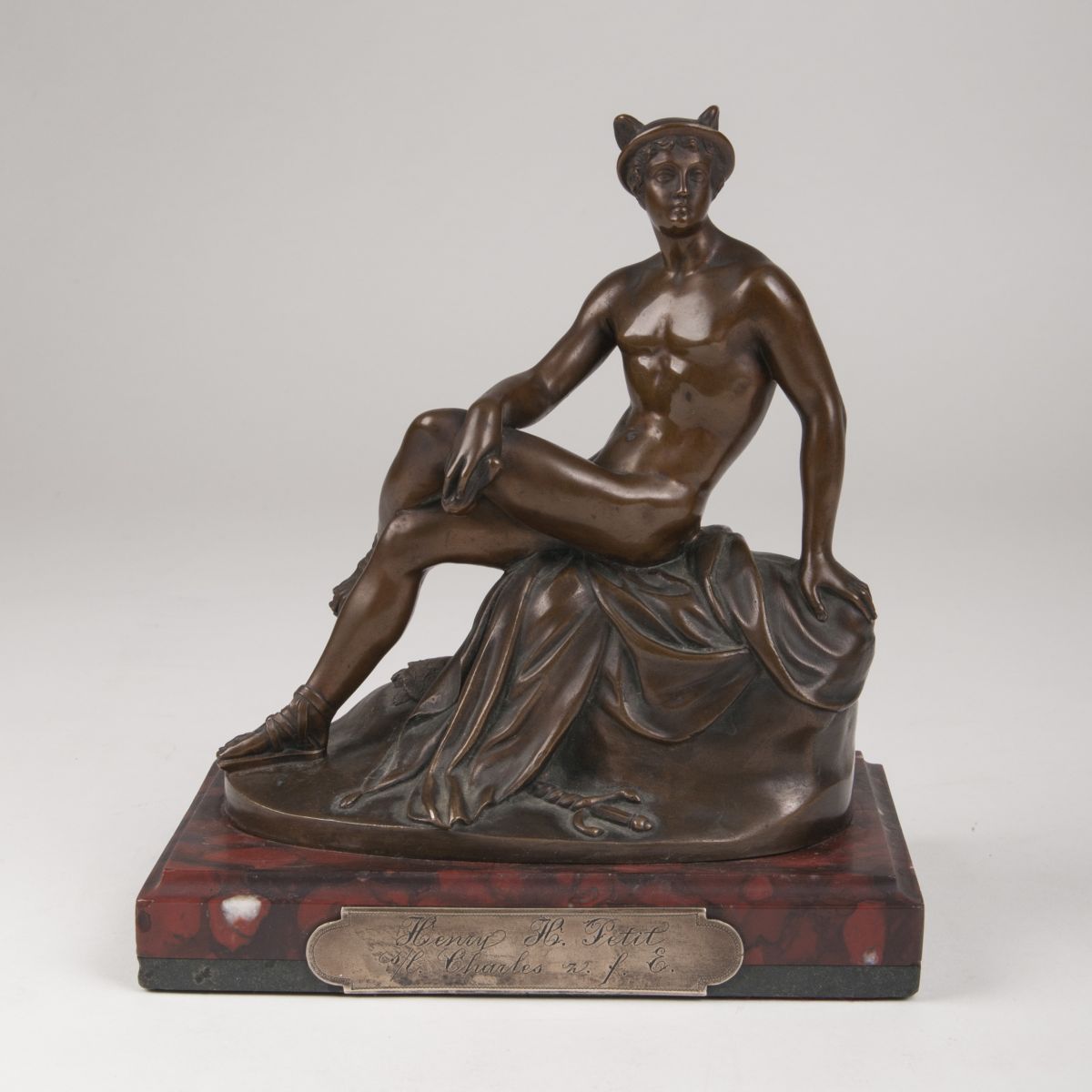 A bronze sculpture 'Seated Hermes'