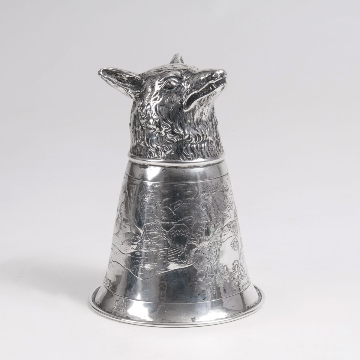 An antique stirrup cup 'fox'
