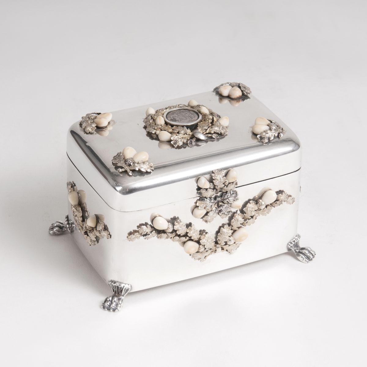 A silver box with grandel decor