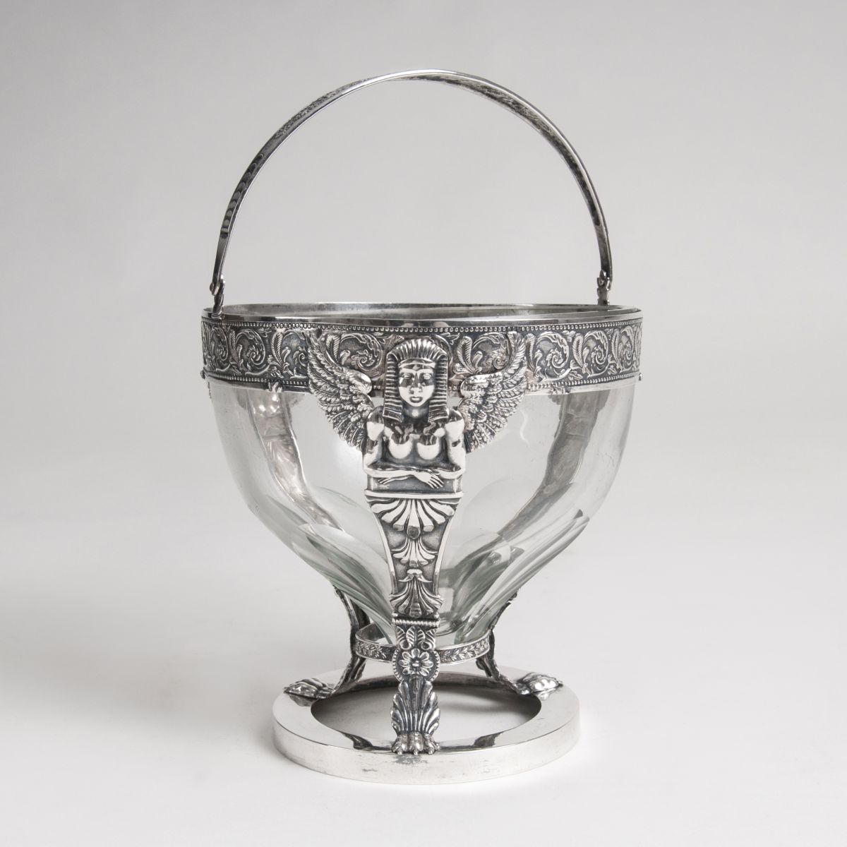 An Empire basket with fine ornaments and glass insert