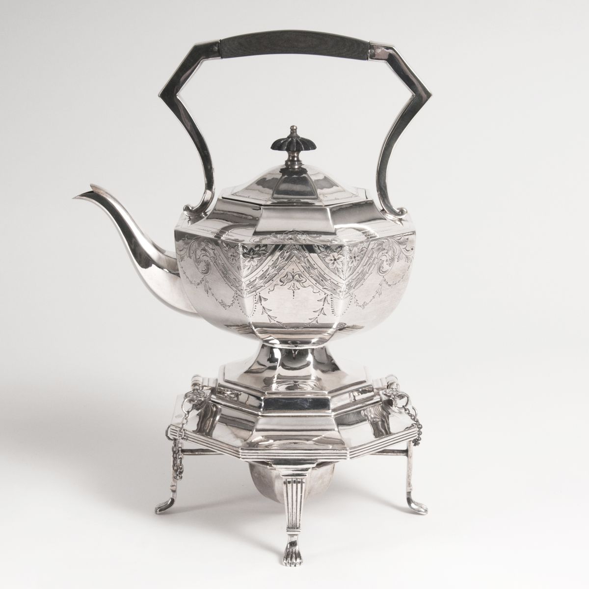 A Victorian teapot with rechaud