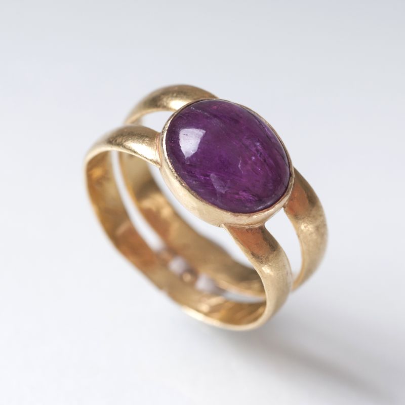 A golden ring with ruby cabochon