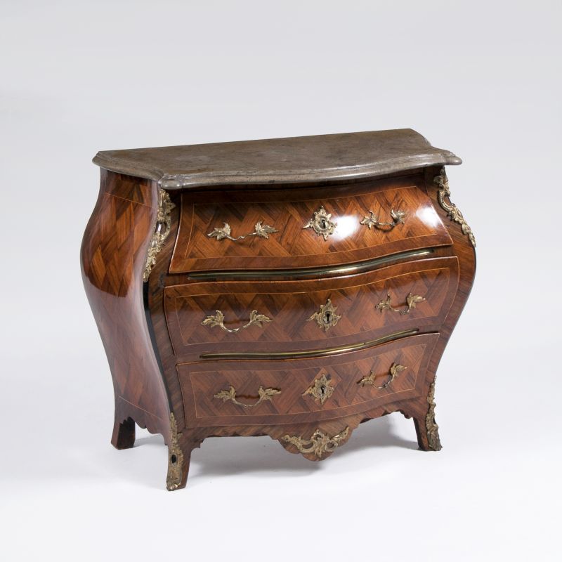 A delicate baroque commode with diamond shaped marquetry