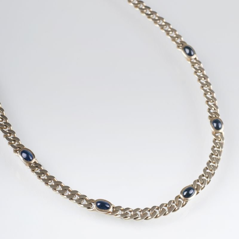 A classic golden necklace with sapphire cabochons