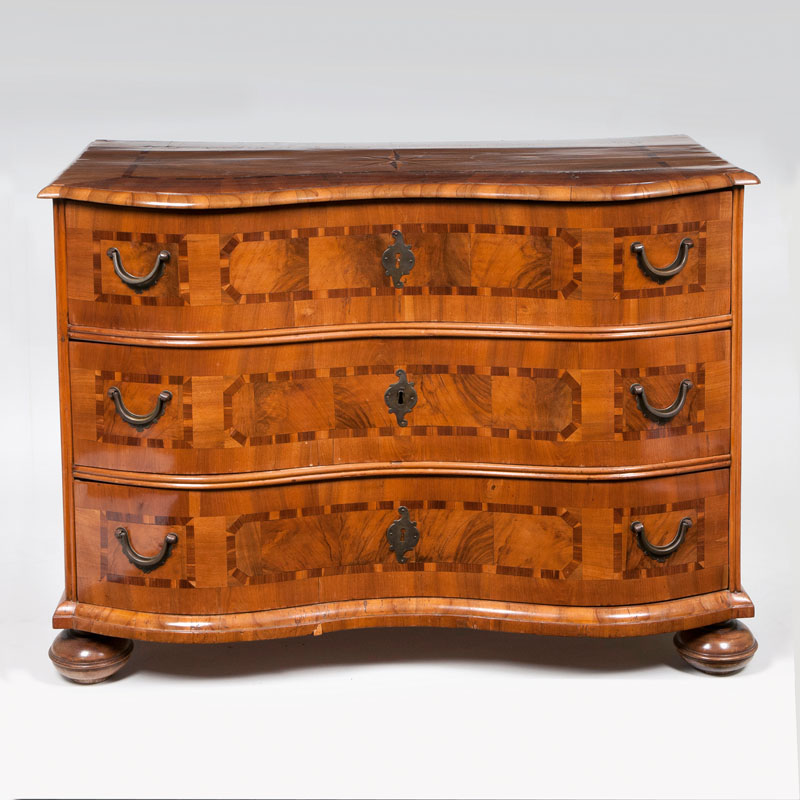 A baroque chest of drawers with star marquetry