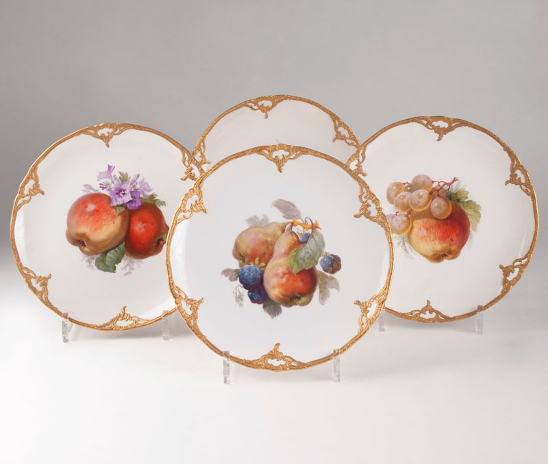 A set of 4  plates with polychrome fruit decor