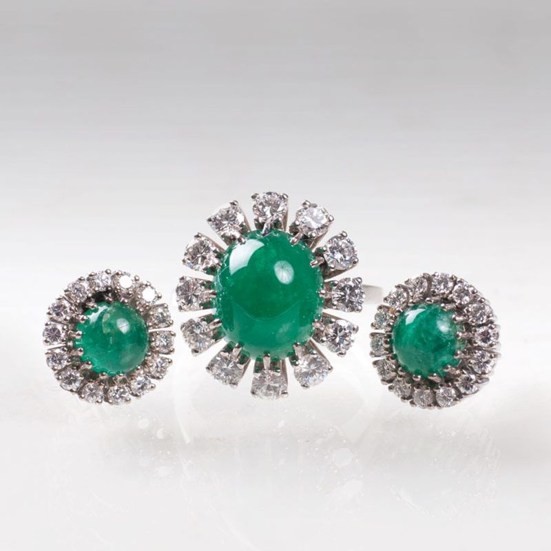 A pair of emerald cabochon earstuds with a ring