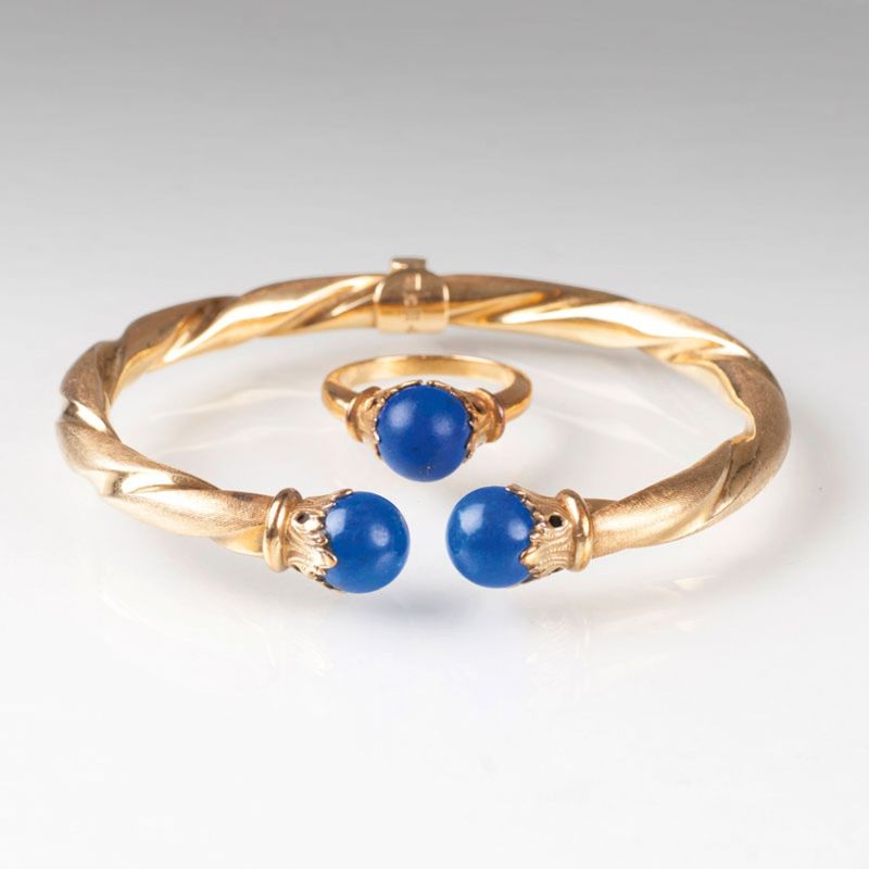 A golden bracelet and ring with lapis lazuli