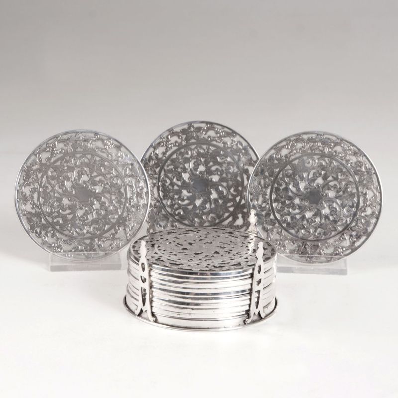 A set of 12 glass coasters with fine overlay-decor