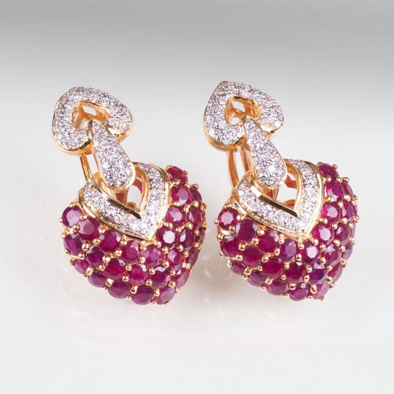 A pair of heart shaped ruby diamond earrings