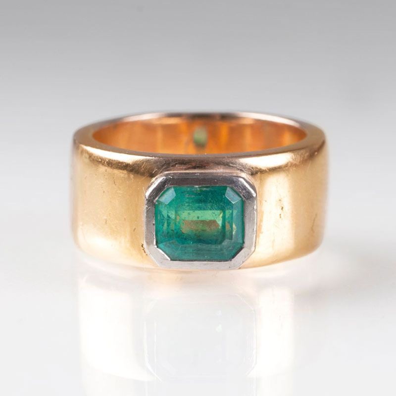 A golden ring with emerald