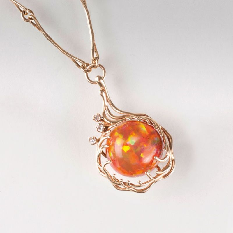 A fire opal diamond pendant with necklace