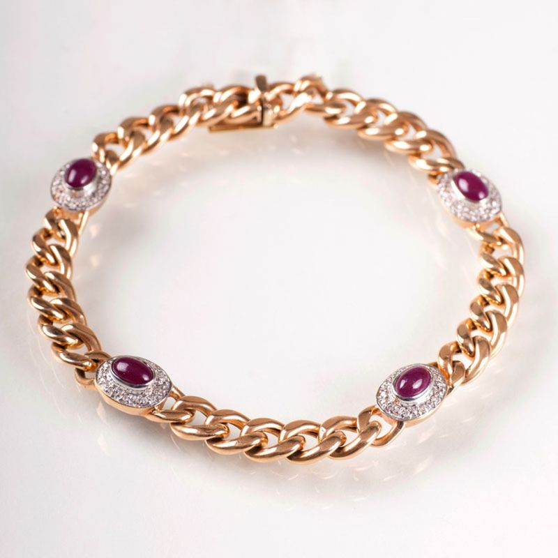A curb chain bracelet with ruby cabochons and diamonds
