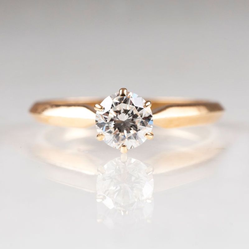 A petite solitaire diamond ring