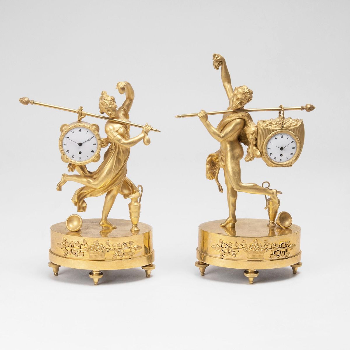 A very rare Pair 'Le Porteur' Empire Tableclocks 'Dancing Omphale' and 'Hercules'