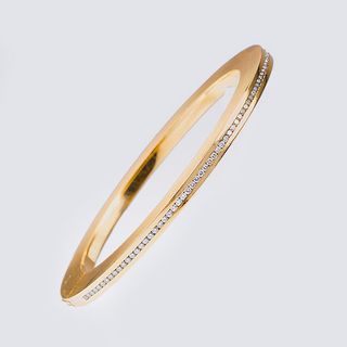 A Modern Golden Bangle Bracelet with Diamonds
