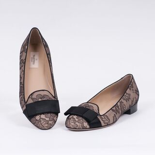 A Pair of Ballerinas with Black Lace